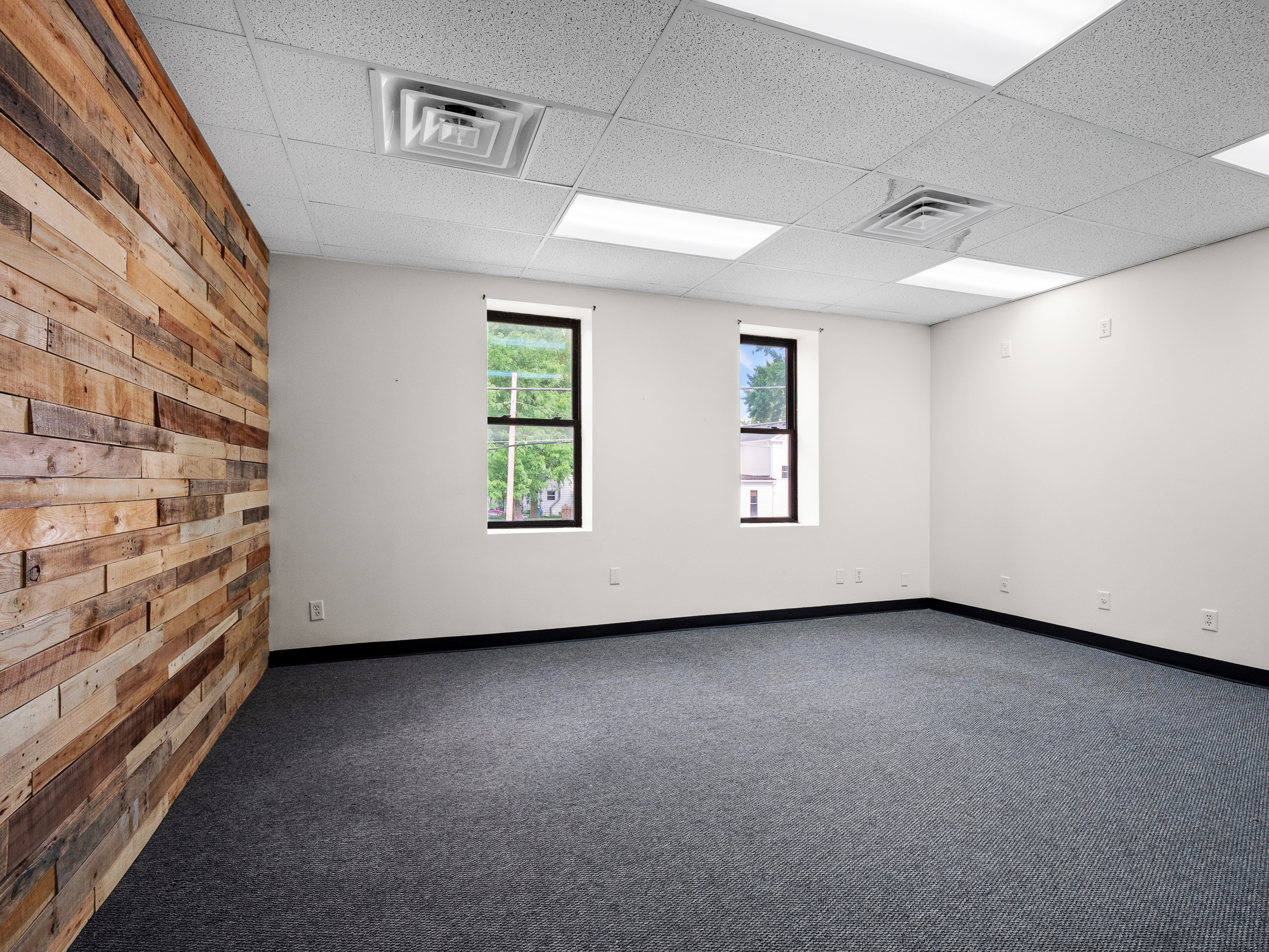 Office with reclaimed wood accent wall