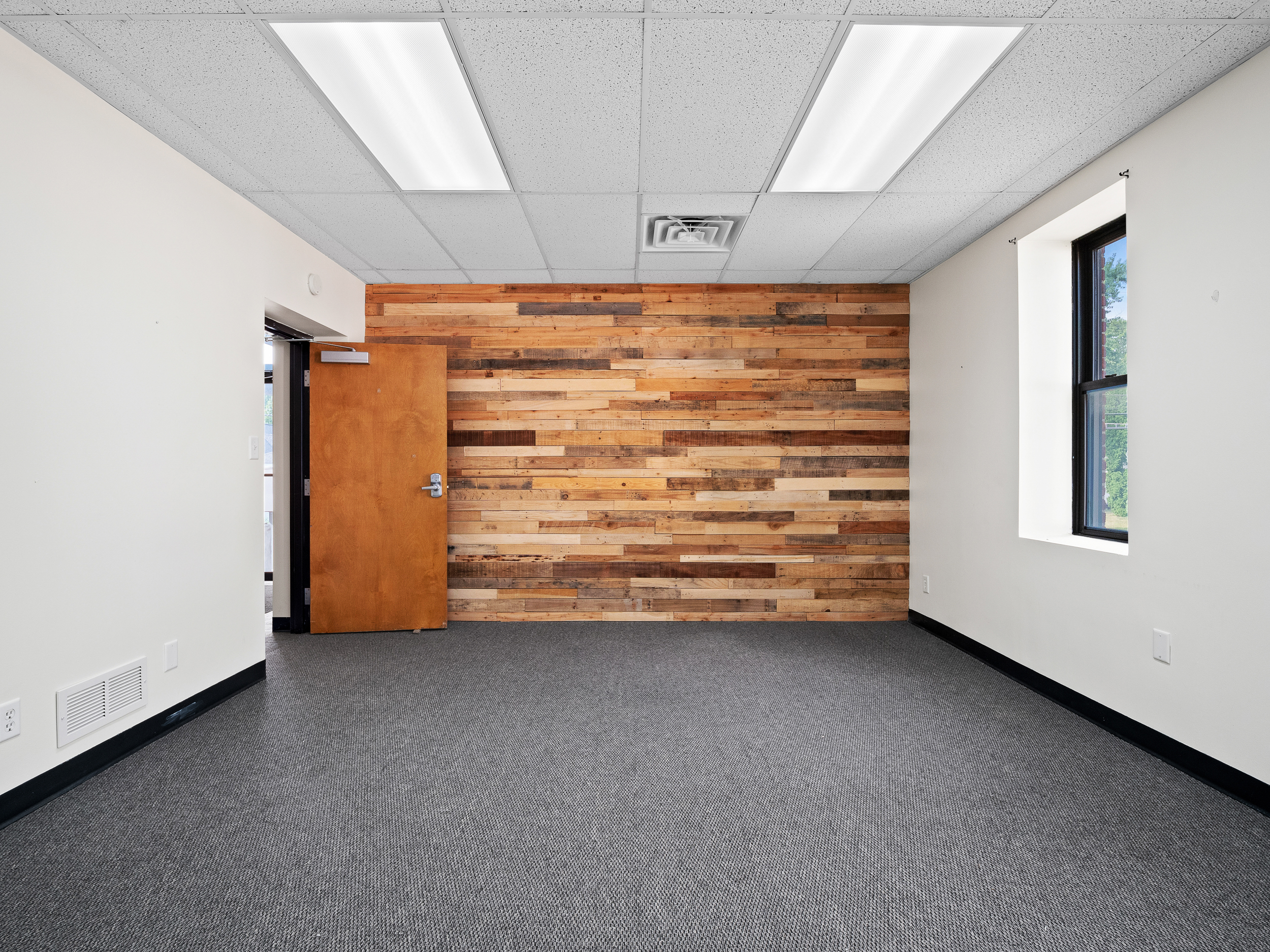 Office with wood wall feature